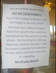 You are picking up your child! GET OFF YOUR PHONE!!!!